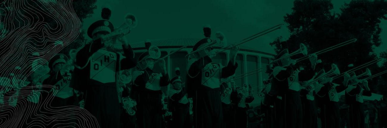 Members of the Marching Band play instruments while standing in formation.